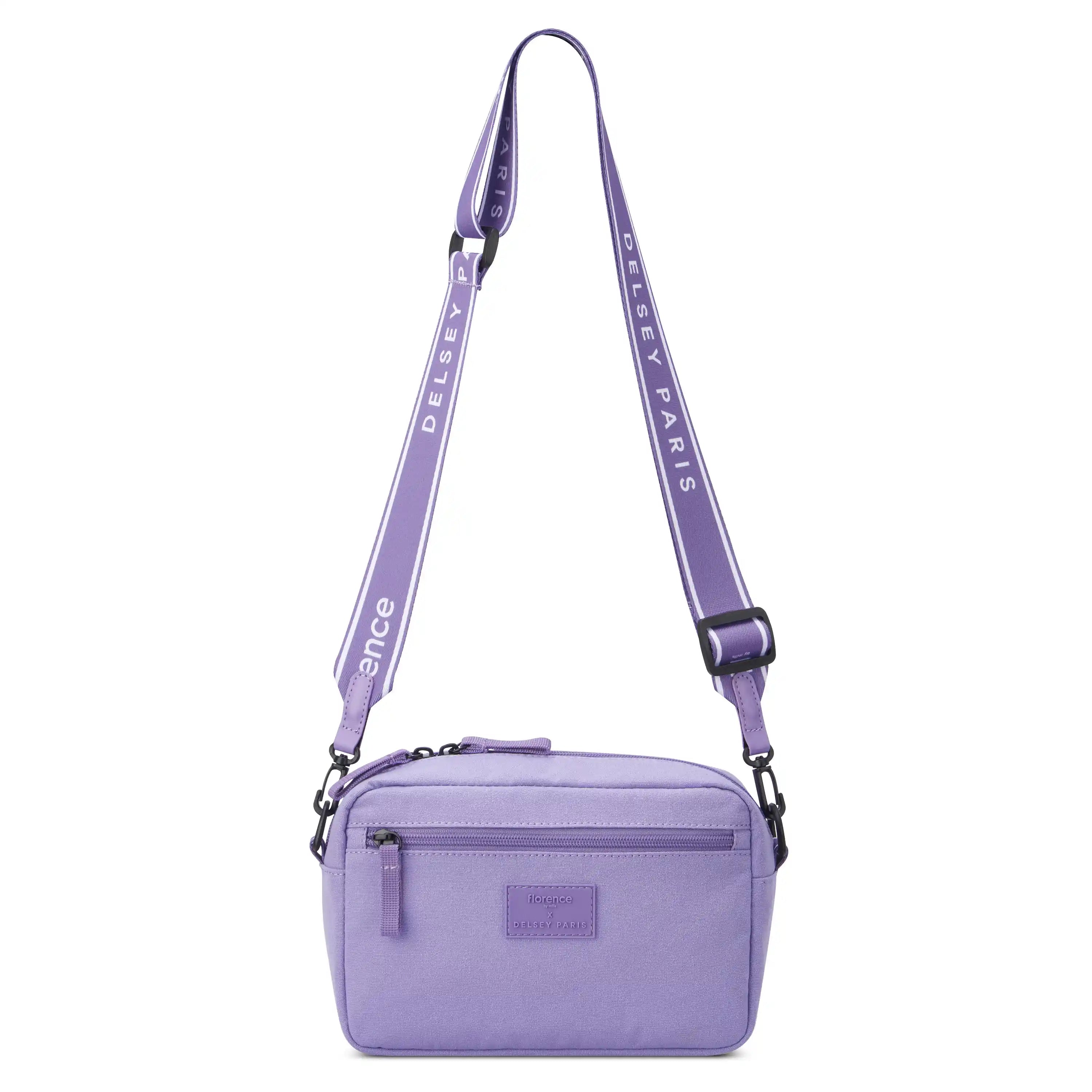 Lavender FREE-SPIRIT crossbody bag with adjustable strap and front zipper pocket.