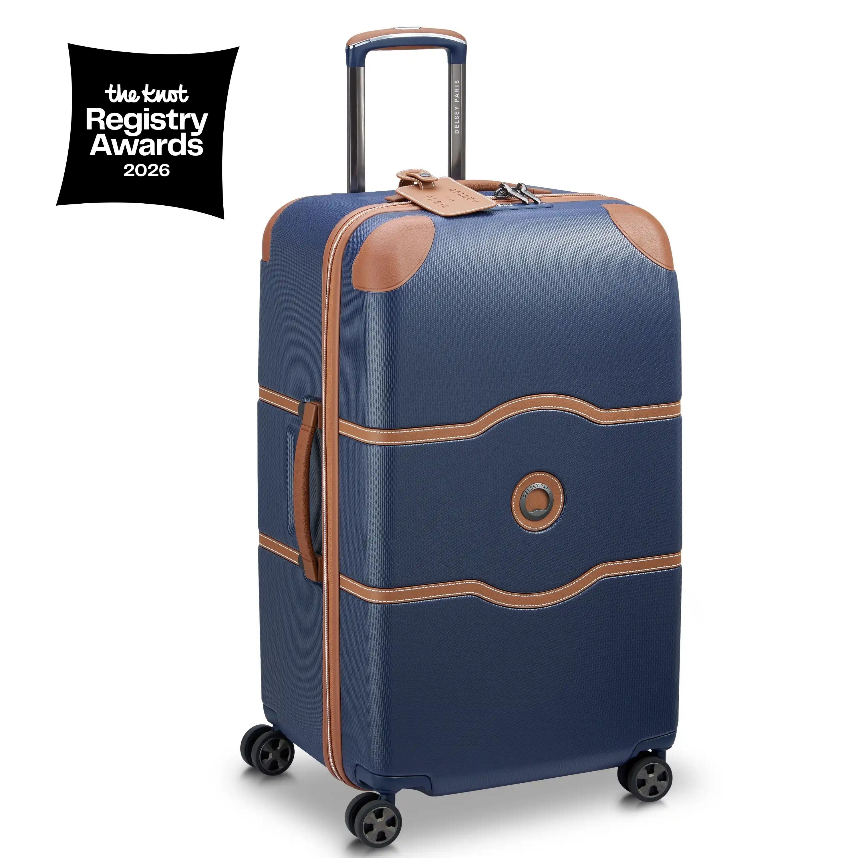 Blue suitcase with brown accents on a white background, featuring the Knot Registry Awards 2026 logo.